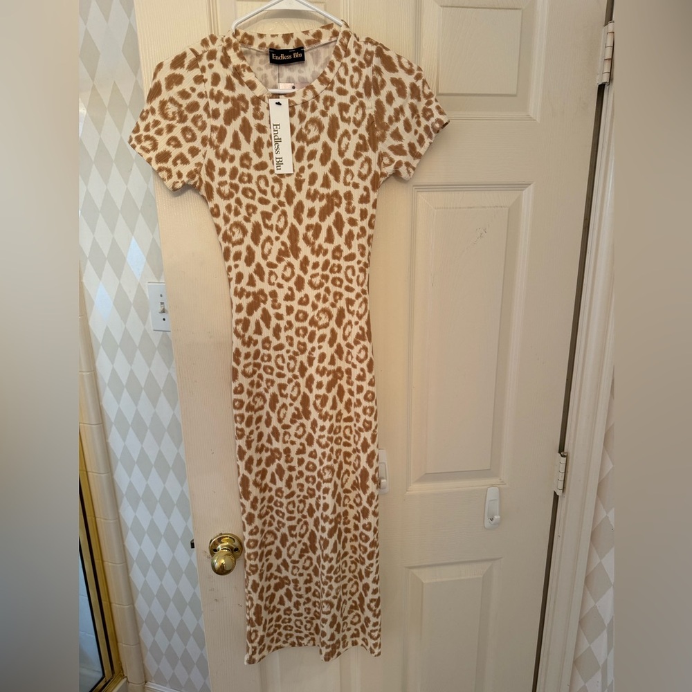 Beautiful tight fitted, open back dress! Size large
